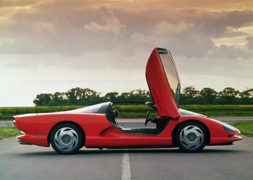 A red Chevrolet Corvette Indy concept car with distinctive upward-opening doors
