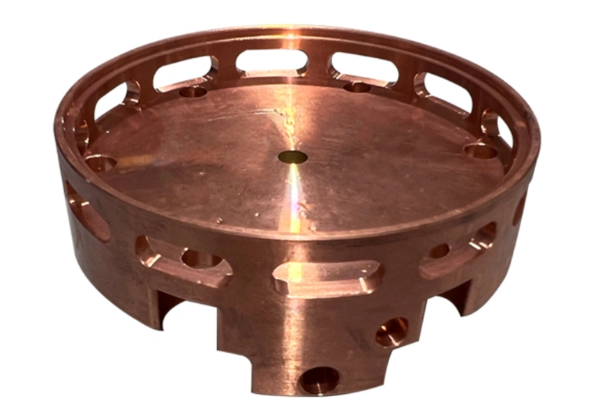 Image of a complex 4-axis CNC-machined copper component with intricate internal features and curved surfaces