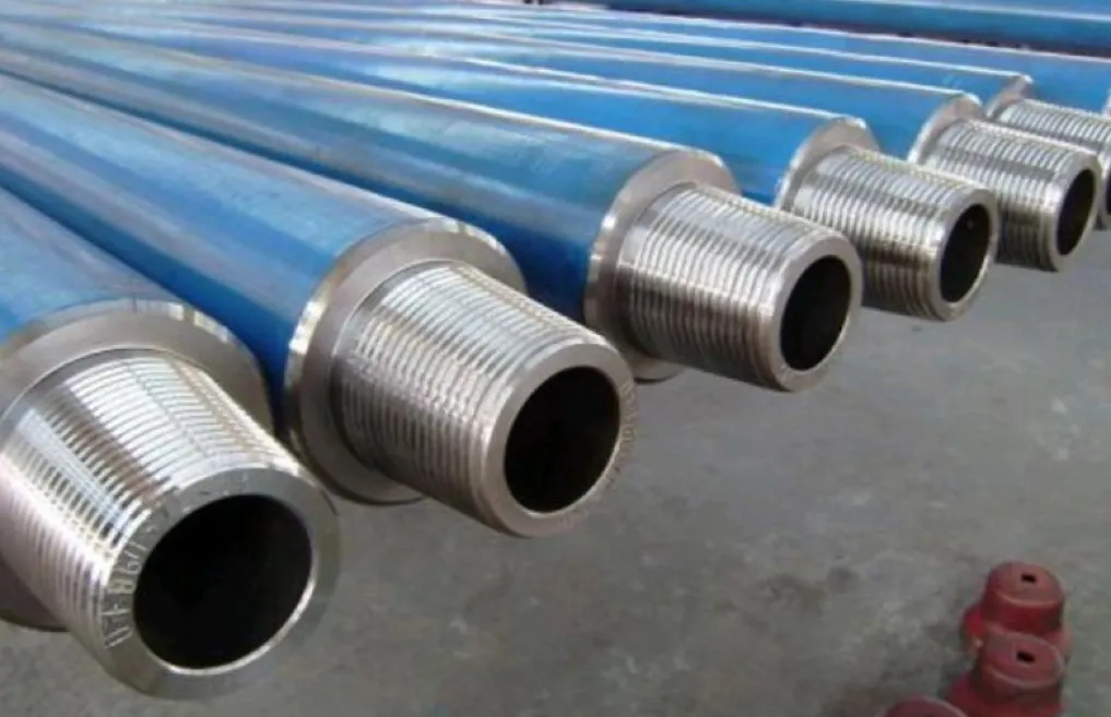 A close-up image of 4140 steel drill collars with threaded ends.