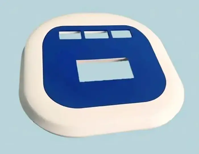 White ABS plastic medical equipment cover or lid with blue interface cutouts and rectangular openings