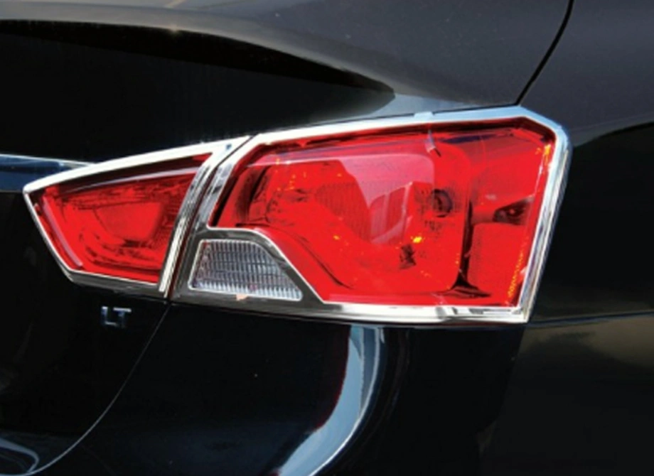 Chrome-trimmed ABS tail light with red and clear lens sections on dark colored vehicle