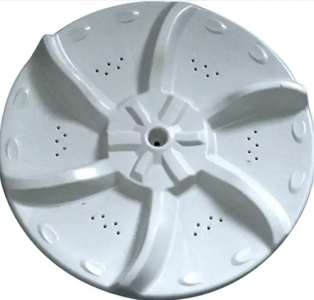 White ABS plastic washing machine agitator disc or pulsator with radial fins and drainage holes