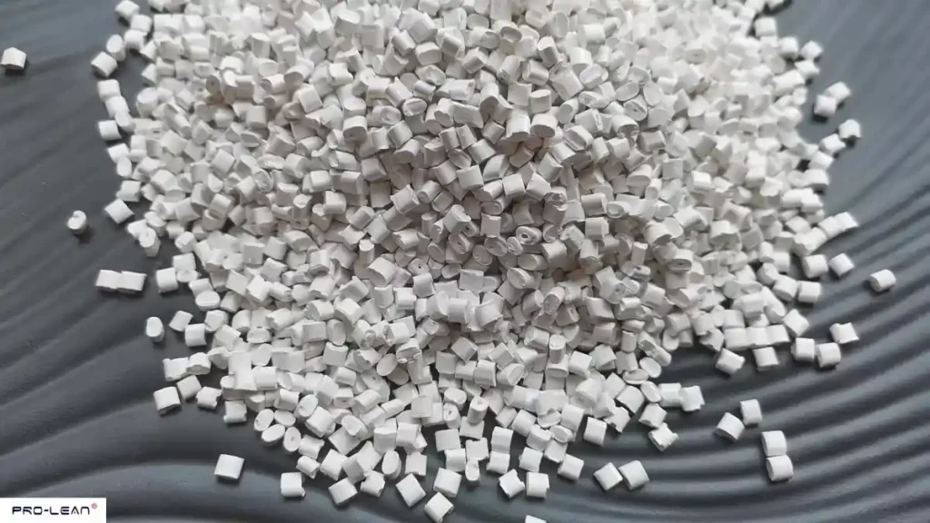 Close-up of many small, white ABS plastic pellets.