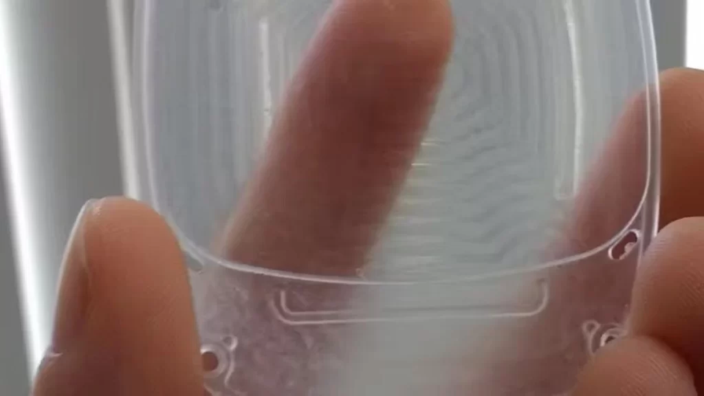Acrylic prototype part displayed with clear details and design.