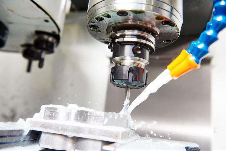 Adding coolant during CNC machining process
