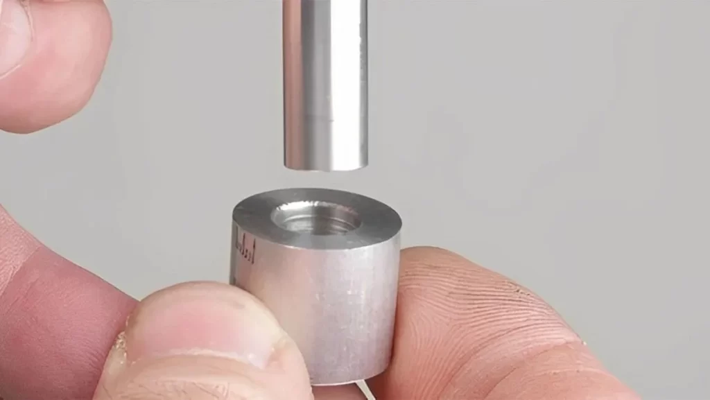 Hand aligning a rod for a slip fit.