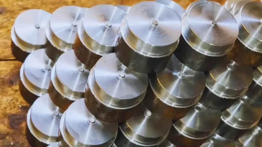 An image showing Aluminum 6061-T6 machined parts neatly arranged for display