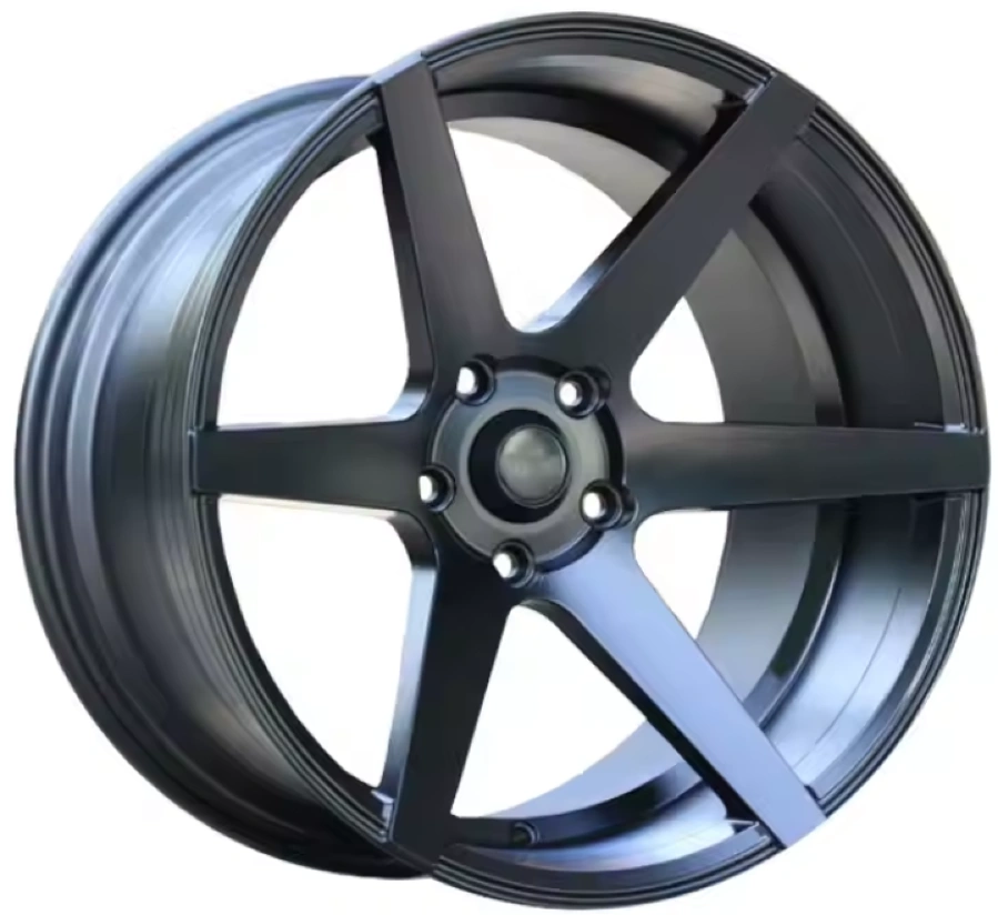 A matte black aluminum alloy car wheel on a white background