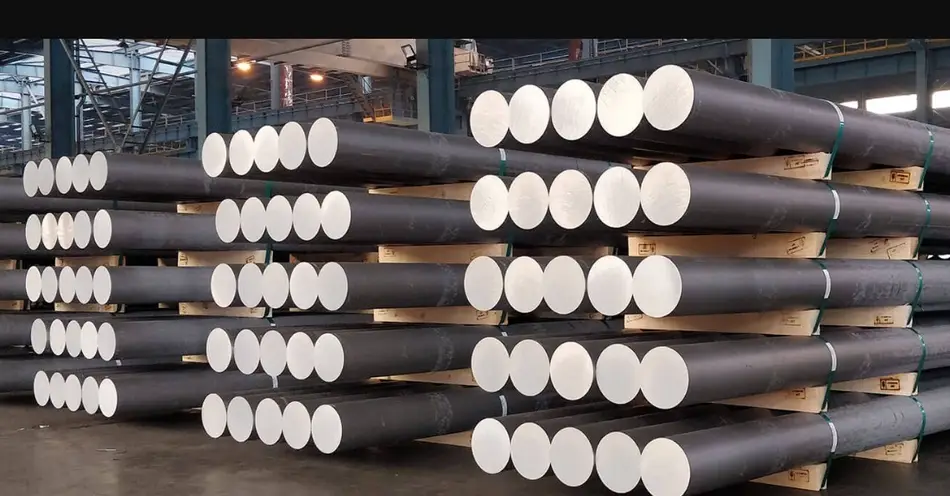 Three well-arranged piles of cylindrical aluminum billets in a warehouse