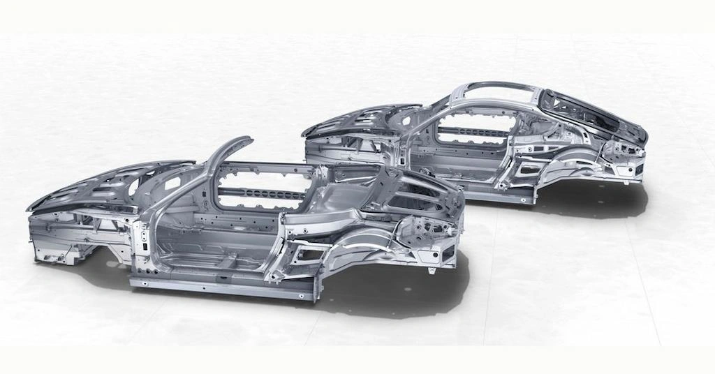 Two aluminum model car bodies made with die casting side by side