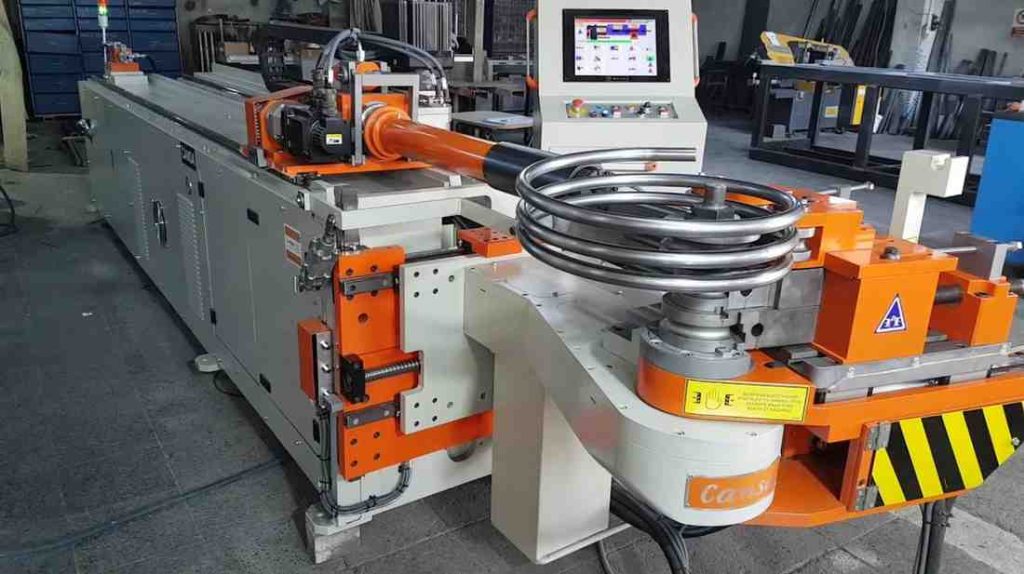 Automated pipe bending machine forming a spiral, precise bends for various industrial uses.