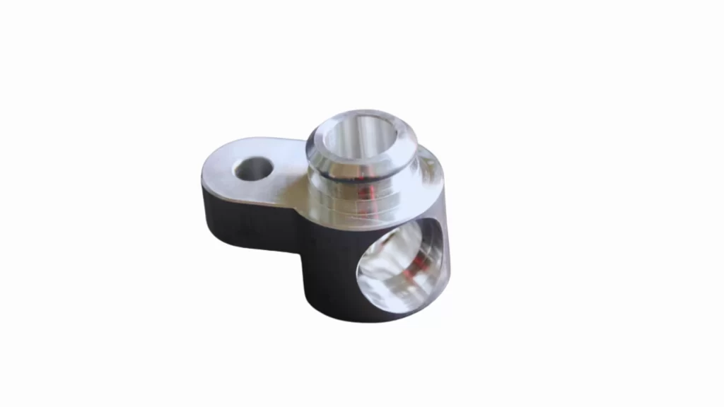 Finished 6063 aluminum part used in automotive assembly with a smooth surface finish.