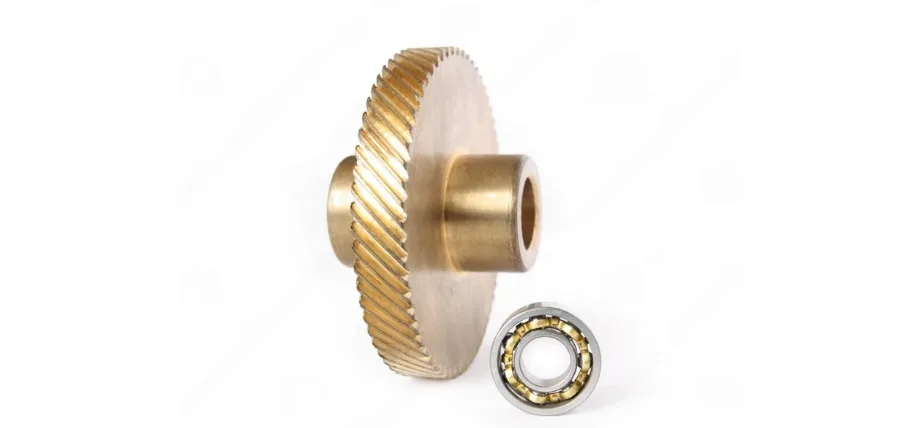 Bronze gear and ball bearing on a white background