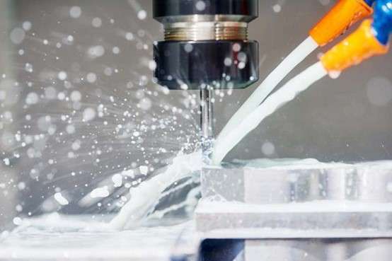 CNC milling machine drilling the hole at mould base parts
