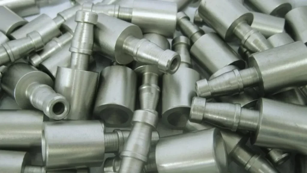 Identical case-hardened metal parts arranged in a precise zigzag pattern.