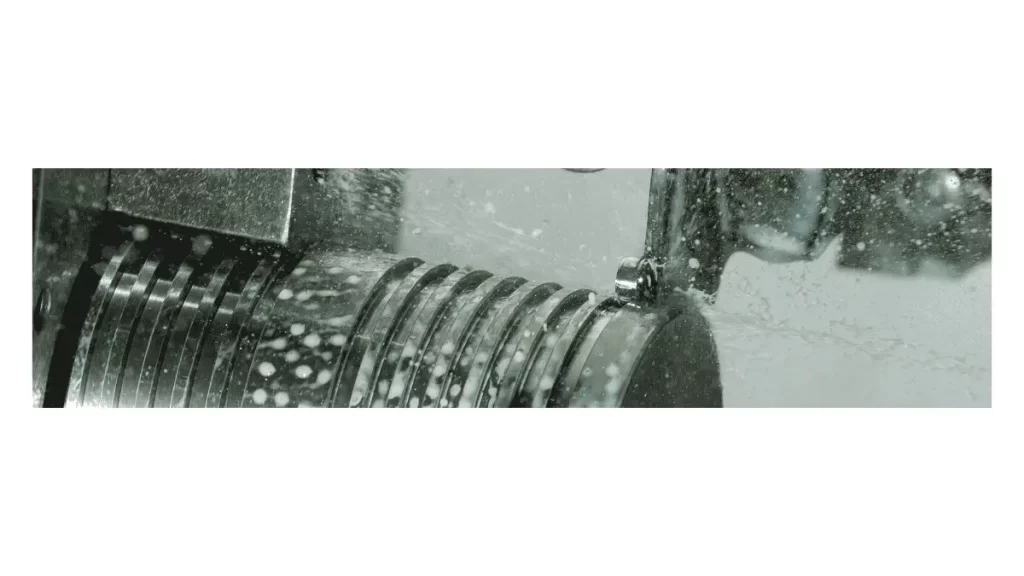 A machining process showing controlled chip formation as the cutting tool removes material from the workpiece.