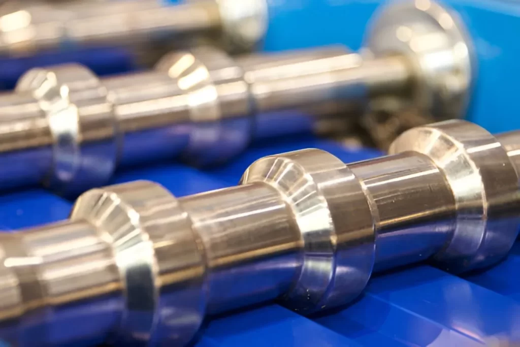 The image shows components displayed with a reflective chromium plating finish.
