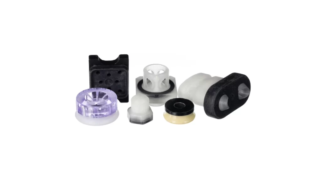Image showing complex two-shot molded parts with different materials and shapes.