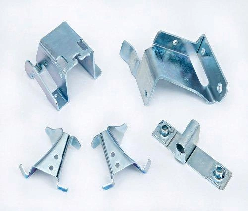 An image with various complex metal stamped parts, emphasizing the the capability of the process.