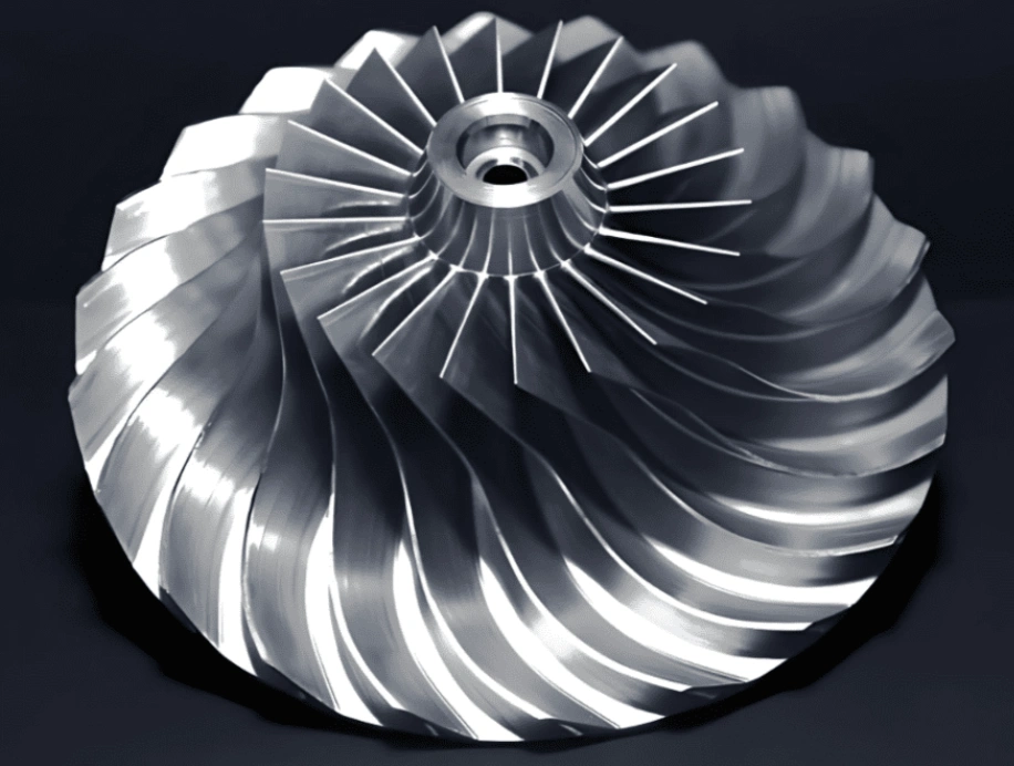 A closeup of an impeller with defined curves produced through profile milling