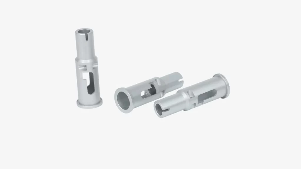 The image shows three identical custom bushings made from stainless steel. All three parts have the same size and shape.