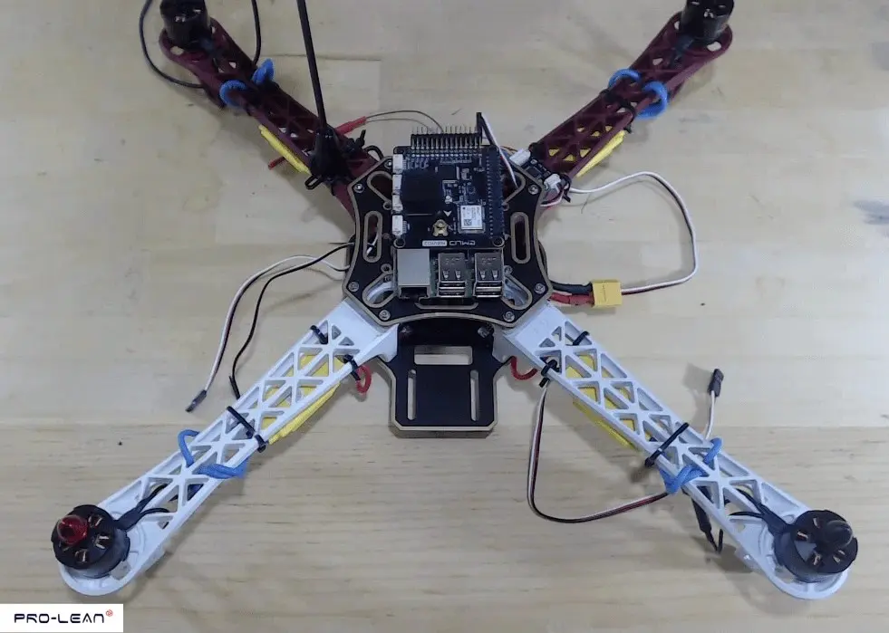 Drone frame with various electronic parts, ready for customization.