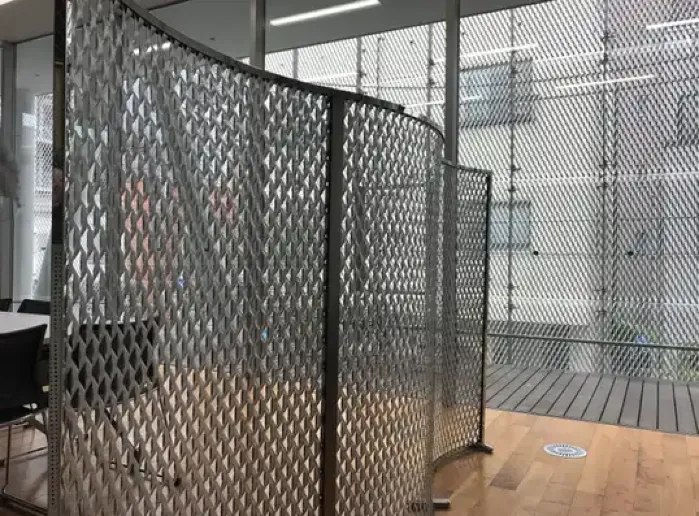 Decorative perforated metal louver panels used as interior partitions