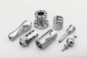 Different aluminum parts placed on a plate