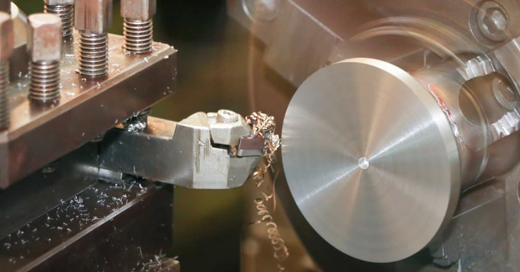 Facing tool refining the end face of cylindrical work on the lathe machine