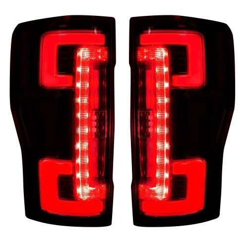 An image of two fiber optic taillights glowing red