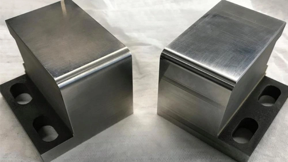 Two aluminum stamping tools with galling defect on the top surface and edges
