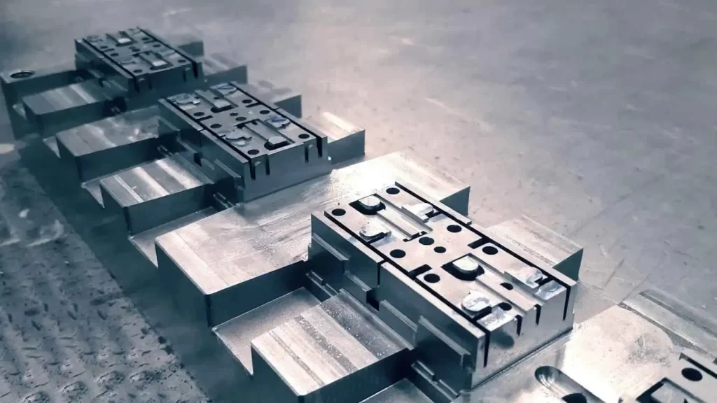 The image displays a hard tooling mold used in injection molding.
