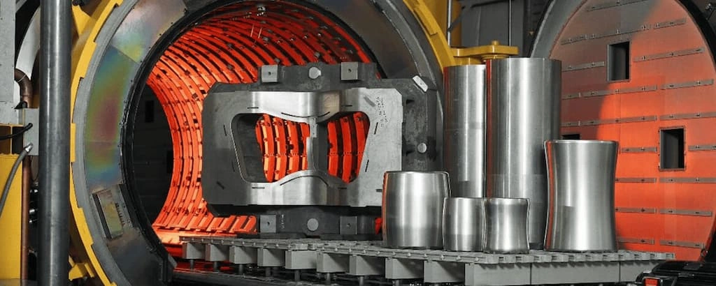 An image showing multiple titanium parts ready to enter the heating chamber for heat treatment