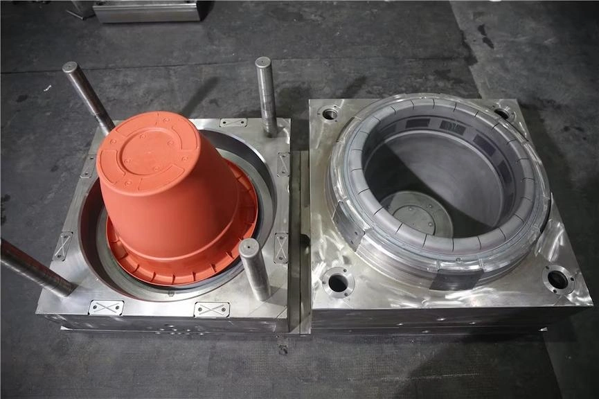 A close up view of demolding flower pot, separating two mold halves