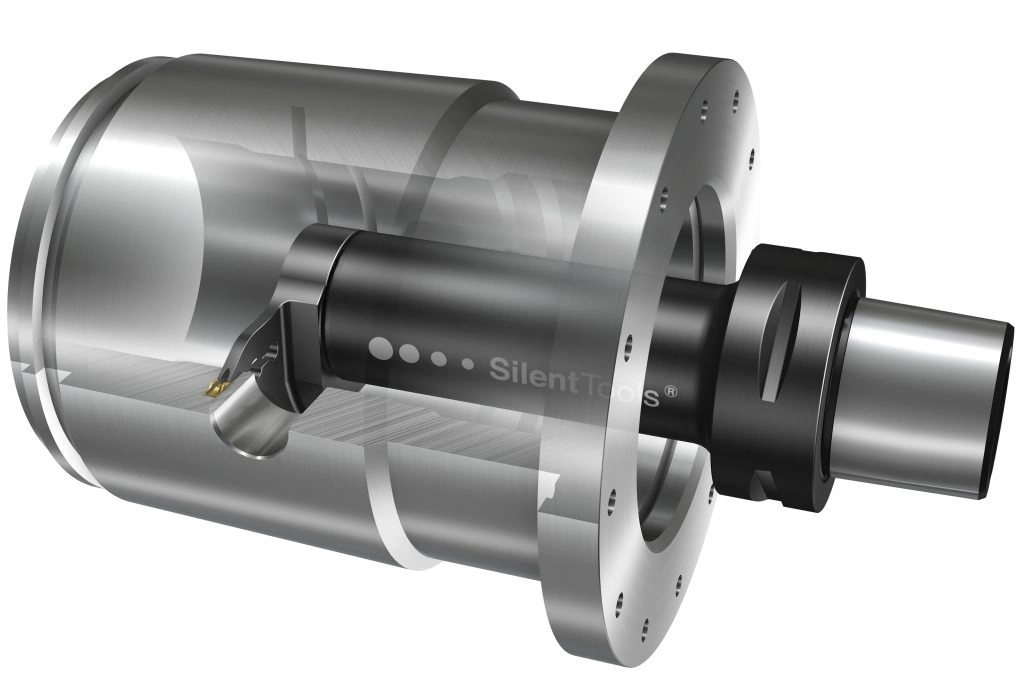 A dark grey grooving tool creating a groove on the inside of a cap-shaped component