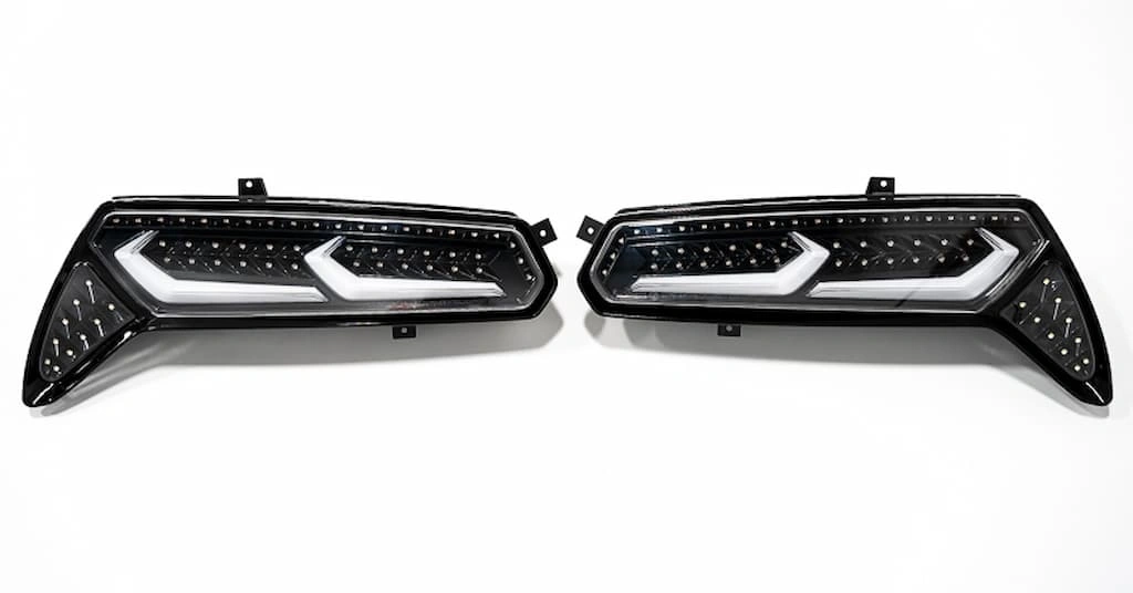 Two LED taillights of a car with custom LED strips and aesthetic cover.