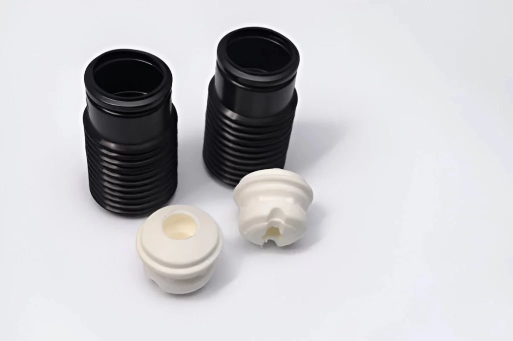 The image displays lightweight Delrin products in both white and black variants.