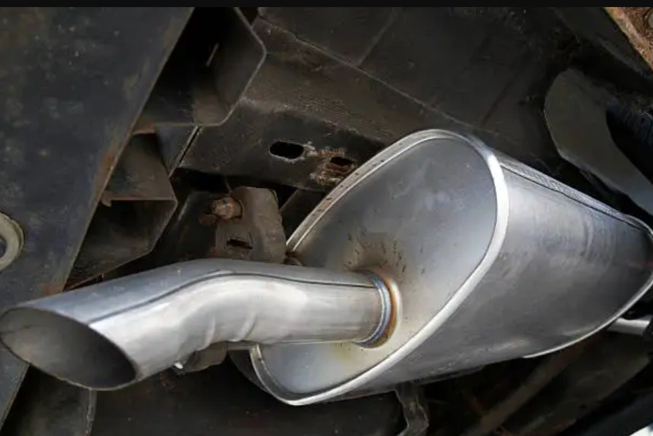 A closeup image of a shiny MIG welded can exhaust
