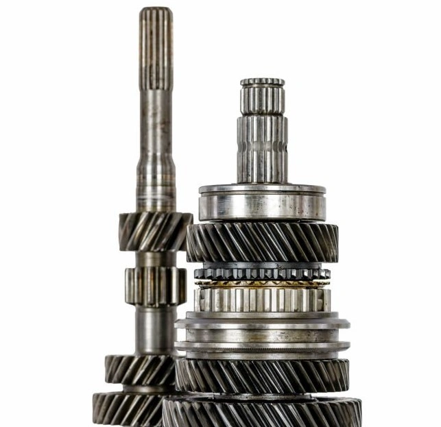 Two metal shafts of different sizes in a vertical position and engaged via gears