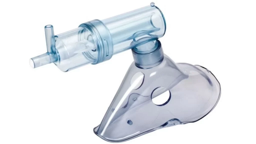 A molded part for a medical device, created through the injection molding process, showing precise detailing and high-quality finish