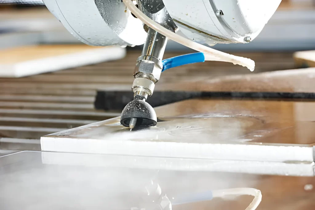 Clear view of metal being cut with a water jet cutter.