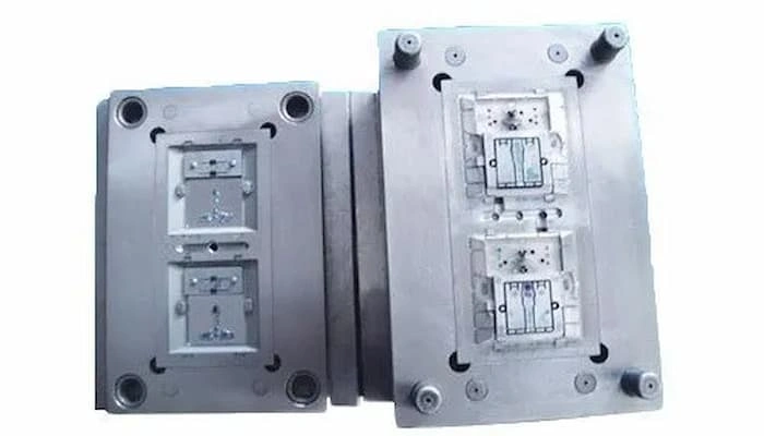 An image showing two halves of the electrical switch mold, cavity & core.