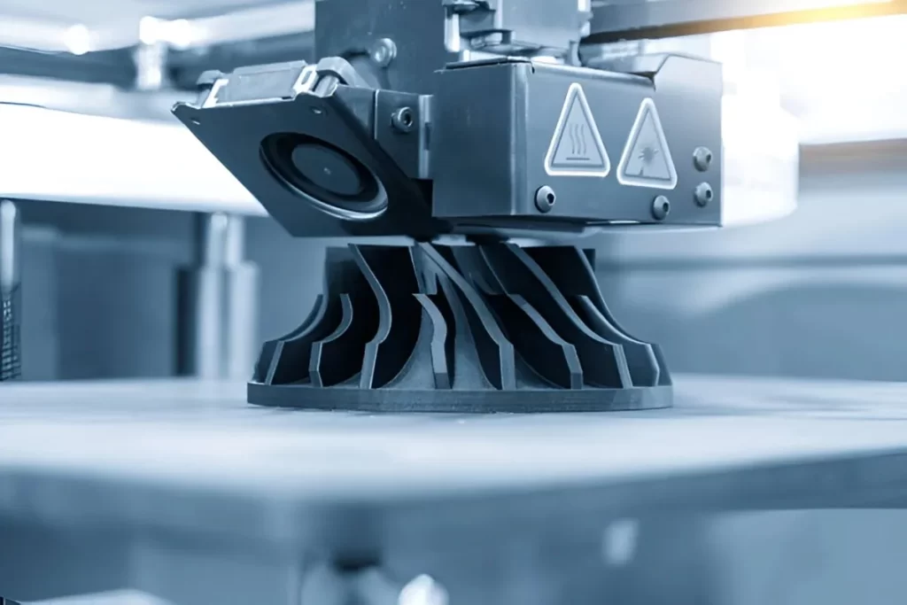 The image shows a nylon part being created through 3D printing.