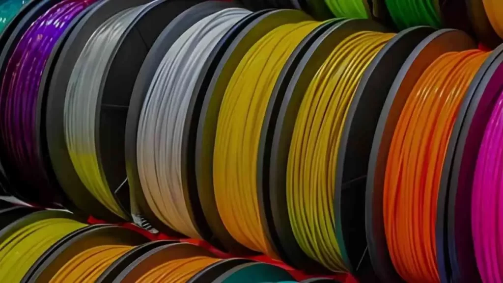 A pile of colorful plastic pellets (red, orange, yellow, green, blue, black)