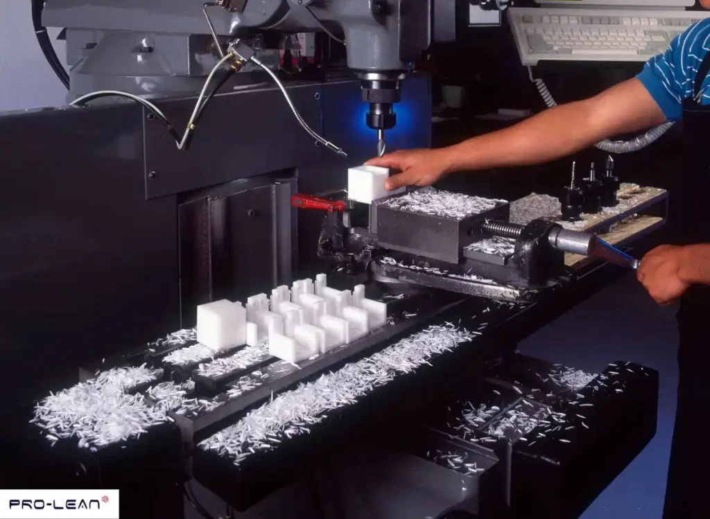 CNC machine cutting white plastic parts, showing acetal/Delrin machining process.