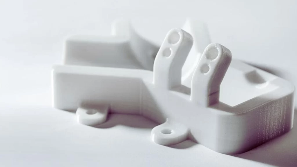 Image displaying a uniquely designed polycarbonate prototype with an off-white color