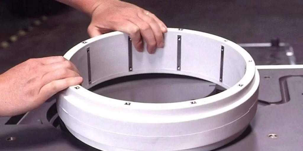 A close up view of holding RIM molded part laying on the table