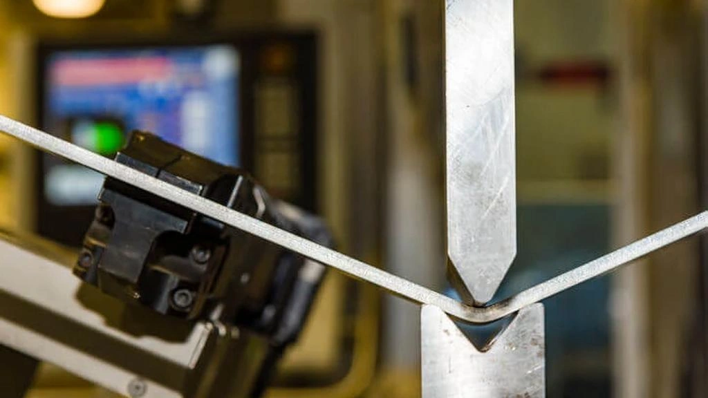 A close-up view of the reinforced metal bending process