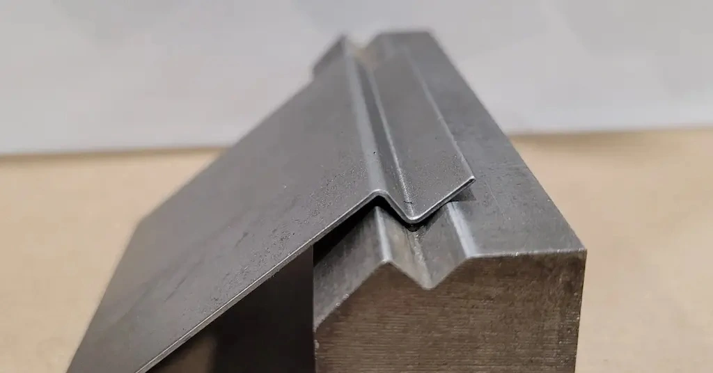 Iron metal bracket over the die 