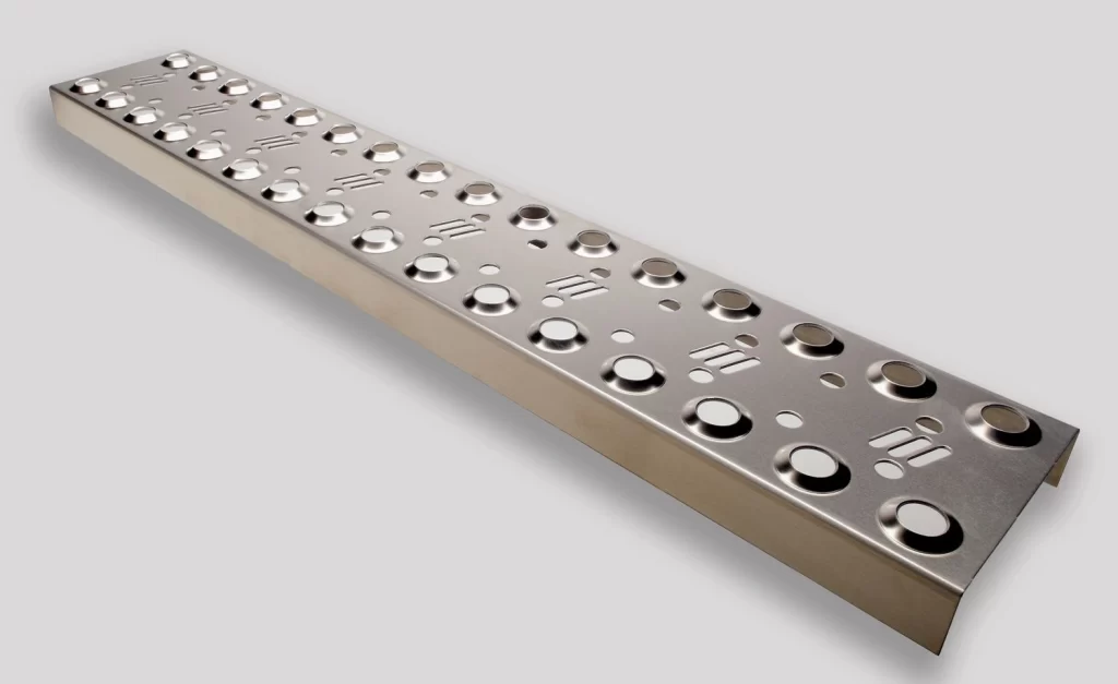 An image of a sheet metal punched part, consistent holes throughout the body